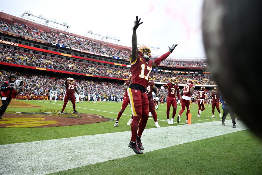 Washington Commanders wide receiver Terry McLaurin (17) celebrates his touchdown against Seattle Seahawks during the second half of an NFL football game Sunday, Sept. 27, 2026 in Landover, Md. (AP Photo/Nick Wass)
