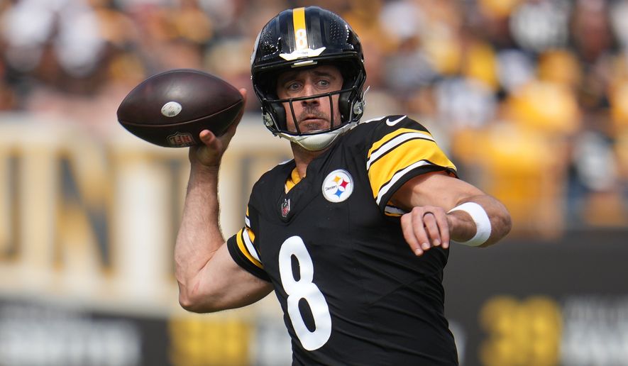 Pittsburgh Steelers quarterback Aaron Rodgers throws a pass during the first half of an NFL football game against the Cincinnati Bengals in Pittsburgh, Sunday, Sept. 27, 2026. (AP Photo/Gene J. Puskar)