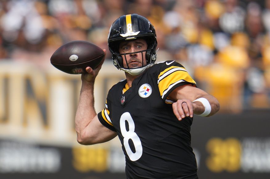Pittsburgh Steelers quarterback Aaron Rodgers throws a pass during the first half of an NFL football game against the Cincinnati Bengals in Pittsburgh, Sunday, Sept. 27, 2026. (AP Photo/Gene J. Puskar)