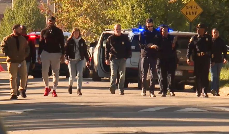 In this image taken from video provided by WXYZ, law enforcement respond to a fatal shooting in Detroit on Sunday, Sept. 27, 2026. (WXYZ via AP)