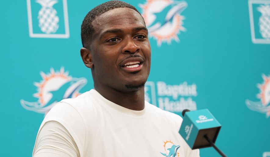 Miami Dolphins running back De'von Achane talks with the news media during practice at the team's NFL football training complex, Tuesday, Sept. 1, 2026, in Miami Gardens, Fla. (AP Photo/Lynne Sladky)