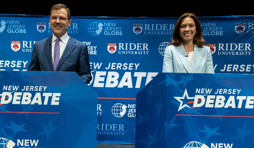 Republican candidate Tom Kean, Jr., left, and Rebecca Bennett, the Democratic candidate in the U.S. Congressional District 7 race look on from stage prior to a debate, Sunday, Sept. 27, 2026, in Rahway, N.J. (AP Photo/Stefan Jeremiah)