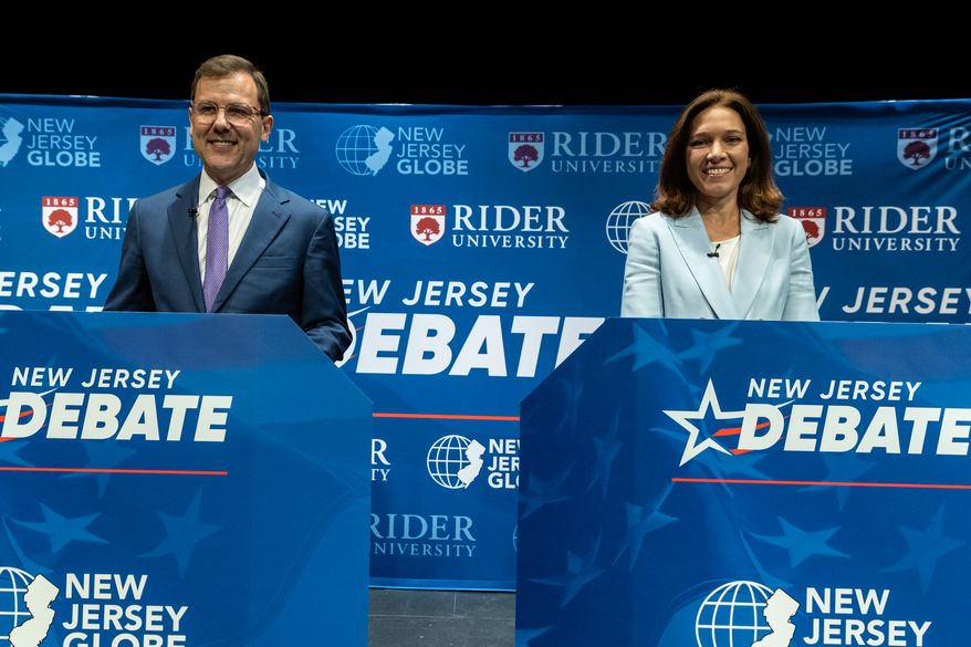 Republican candidate Tom Kean, Jr., left, and Rebecca Bennett, the Democratic candidate in the U.S. Congressional District 7 race look on from stage prior to a debate, Sunday, Sept. 27, 2026, in Rahway, N.J. (AP Photo/Stefan Jeremiah)