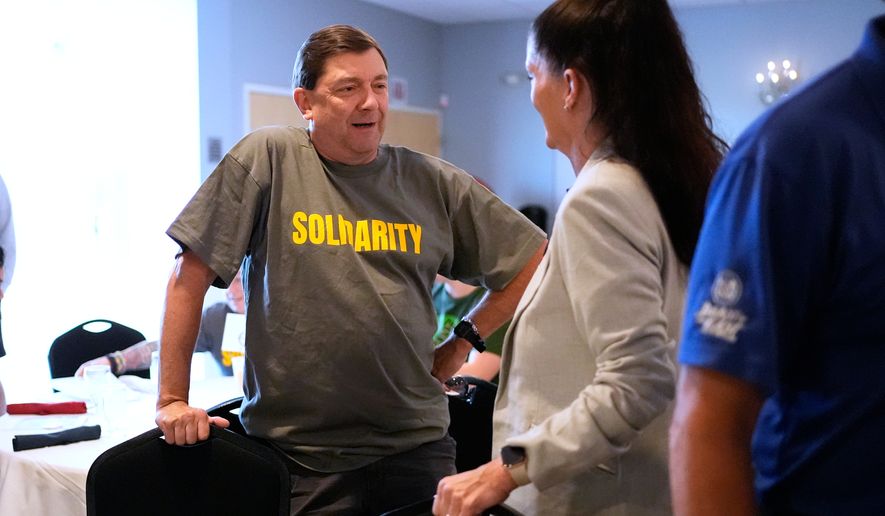 Troy Jackson, Democratic candidate for U.S. Senate, listens to a supporter at the Southern Maine Labor Council breakfast, Monday, Sept. 7, 2026, in South Portland, Maine. (AP Photo/Robert F. Bukaty)