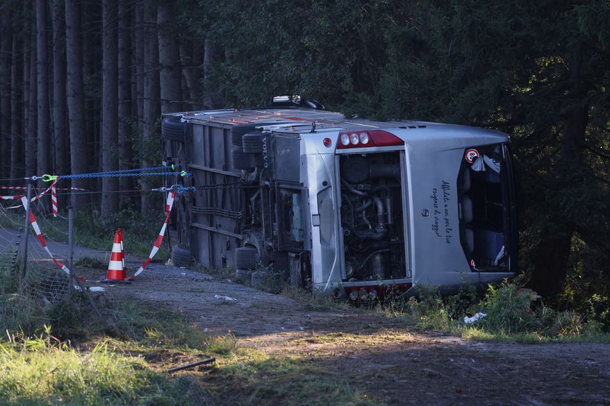 A view of the scene after a tourist bus veered off a highway, in Buchloe, Germany, Sunday, Sept. 27, 2026. (Karl-Josef Hildenbrand/dpa via AP)