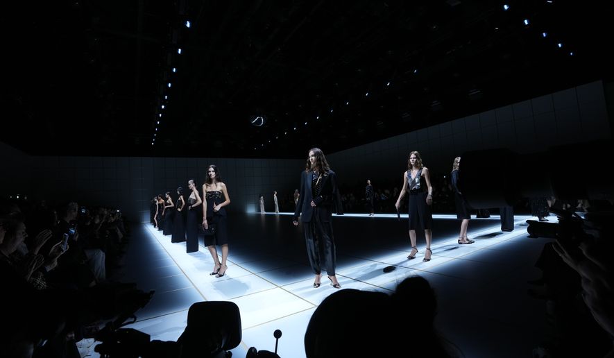 Models wear creations part of the Giorgio Armani women's Spring-Summer 2027 collection, presented in Milan, Italy, Sunday, Sept. 27, 2026. (AP Photo/Luca Bruno)