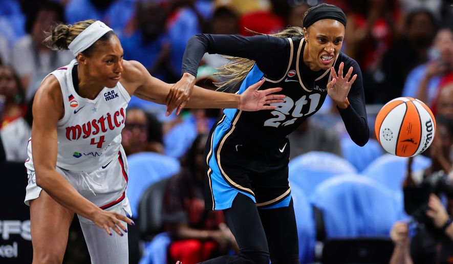 Washington Mystics guard Betnijah Laney-Hamilton, left, fights for the ball with Atlanta Dream forward DeWanna Bonner, right, during the first half in Game 1 of an WNBA basketball first-round playoff series, Sunday, Sept. 27, 2026, in Atlanta. (AP Photo/Colin Hubbard)