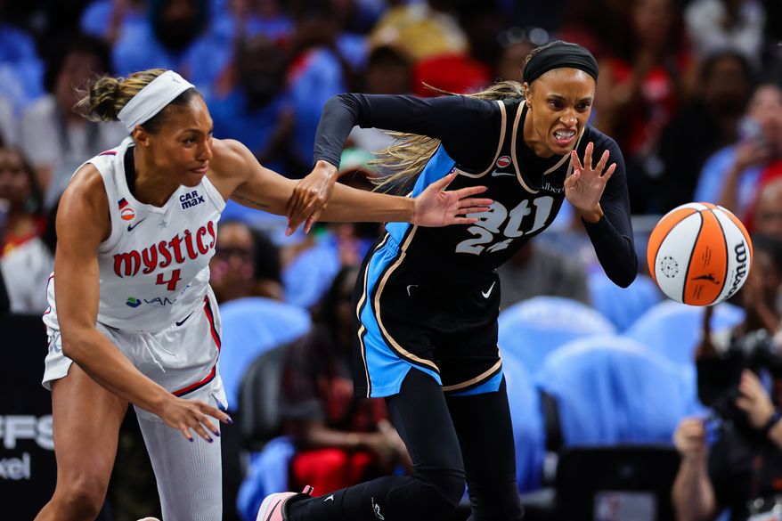 Washington Mystics guard Betnijah Laney-Hamilton, left, fights for the ball with Atlanta Dream forward DeWanna Bonner, right, during the first half in Game 1 of an WNBA basketball first-round playoff series, Sunday, Sept. 27, 2026, in Atlanta. (AP Photo/Colin Hubbard)