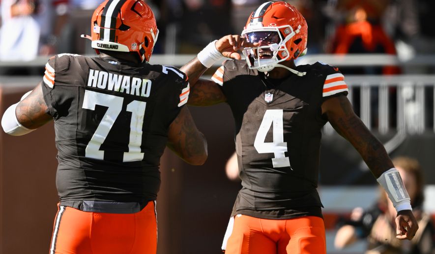 Cleveland Browns quarterback Deshaun Watson (4) celebrates after throwing for a 2-point conversion against the Carolina Panthers during the second half of an NFL football game in Cleveland, Sunday, Sept. 27, 2026. (AP Photo/David Richard)