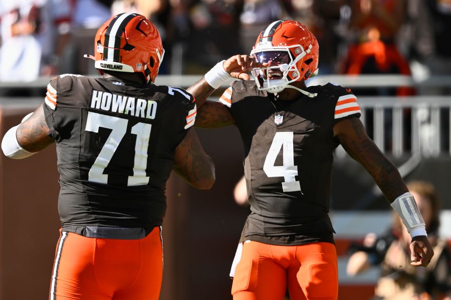 Cleveland Browns quarterback Deshaun Watson (4) celebrates after throwing for a 2-point conversion against the Carolina Panthers during the second half of an NFL football game in Cleveland, Sunday, Sept. 27, 2026. (AP Photo/David Richard)