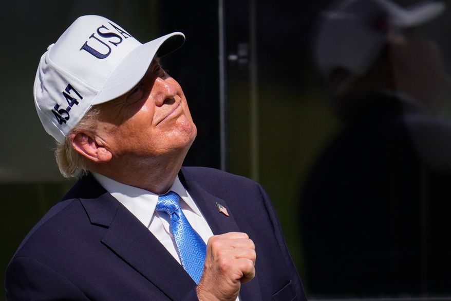 President Donald Trump pumps his fist on the first tee box prior to the Presidents Cup golf tournament final round singles matches between the USA and International teams at Medinah Country Club, Sunday, Sept. 27, 2026, in Medinah, Ill. (AP Photo/Matt Slocum)