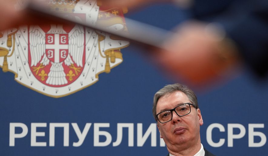 Serbian President Aleksandar Vucic looks on as documents are exchanged after the signing of an agreement following talks with Azerbaijan President Ilham Aliyev at the Serbia Palace in Belgrade, Serbia, Feb. 15, 2026. (AP Photo/Darko Vojinovic, File)