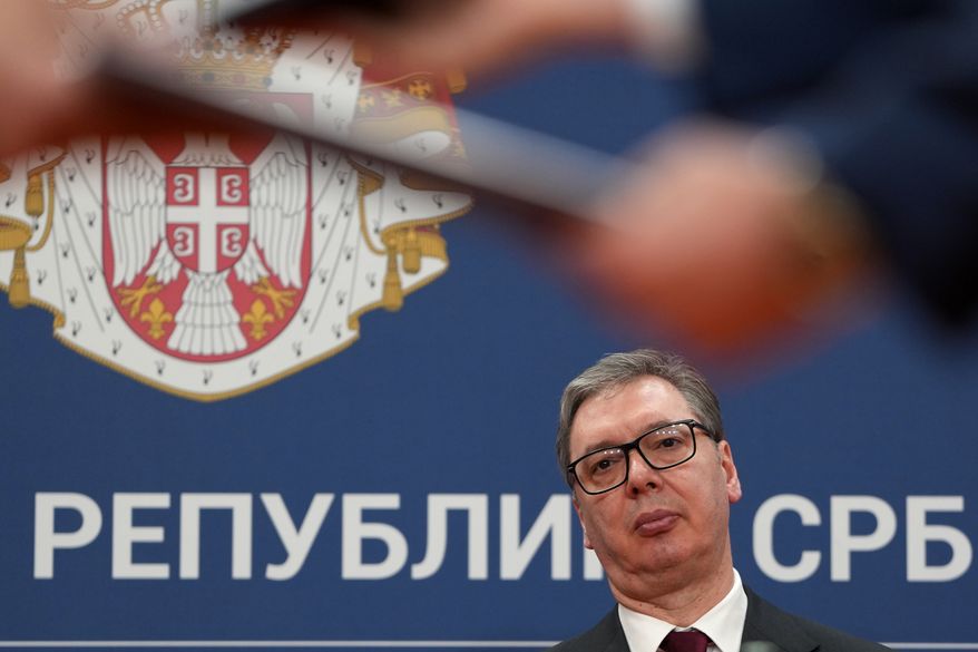 Serbian President Aleksandar Vucic looks on as documents are exchanged after the signing of an agreement following talks with Azerbaijan President Ilham Aliyev at the Serbia Palace in Belgrade, Serbia, Feb. 15, 2026. (AP Photo/Darko Vojinovic, File)