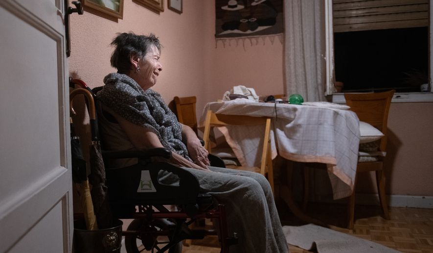 Maricarmen, 87, waits at home for police to arrive before being evicted from the home where she lived in Madrid, Spain, Wednesday, Sept. 23, 2026. (Fernando Sánchez/Europa Press via AP)