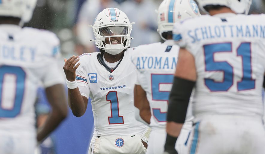 Tennessee Titans quarterback Cam Ward (1) yells to his teammates during the first half of an NFL football game against the New York Giants in East Rutherford, N.J., Sunday, Sept. 27, 2026. (AP Photo/Adam Hunger)