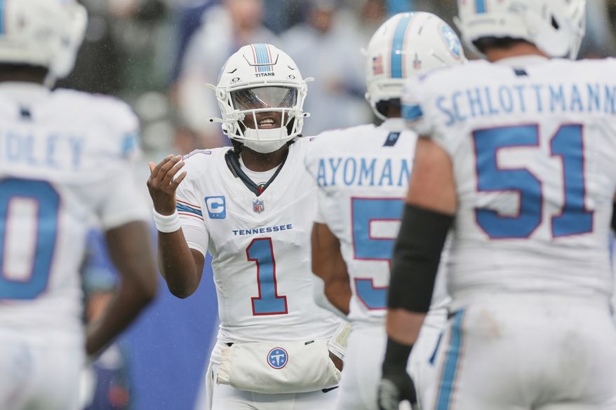 Tennessee Titans quarterback Cam Ward (1) yells to his teammates during the first half of an NFL football game against the New York Giants in East Rutherford, N.J., Sunday, Sept. 27, 2026. (AP Photo/Adam Hunger)