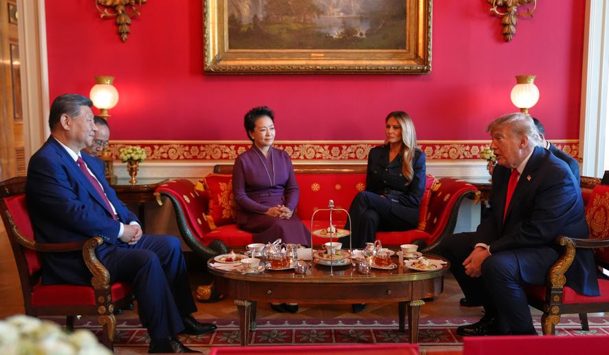 President Donald Trump, from right, and first lady Melania Trump attend a tea with China's President Xi Jinping, from left, and his wife Peng Liyuan in the Red Room of the White House, Friday, Sept. 25, 2026, in Washington. (AP Photo/Jacquelyn Martin)