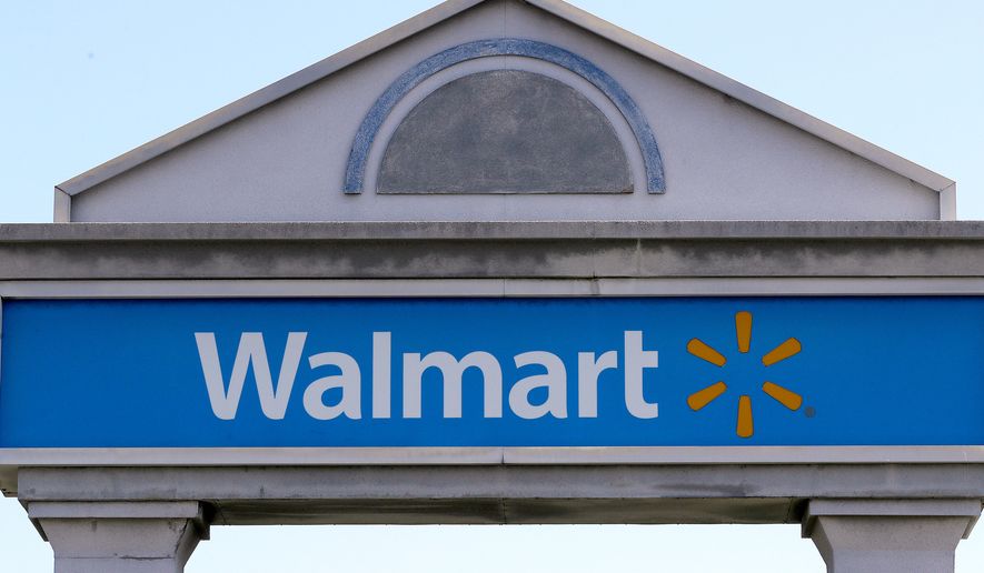 A Walmart sign stands outside a store, Sept. 3, 2019, in Walpole, Mass. (AP Photo/Steven Senne, File)
