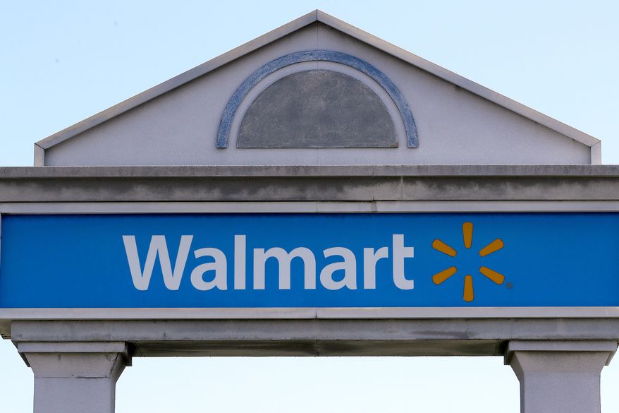 A Walmart sign stands outside a store, Sept. 3, 2019, in Walpole, Mass. (AP Photo/Steven Senne, File)