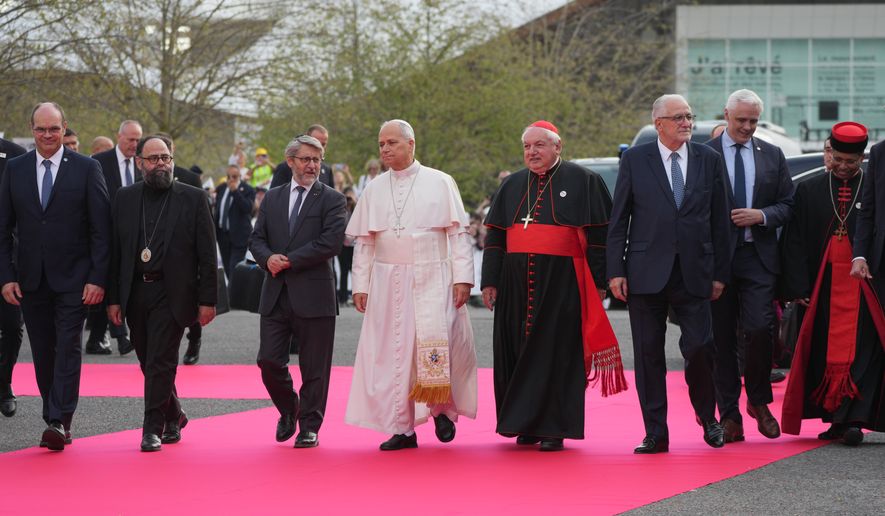 Pope Leo XIV, center, arrives, with, from left, Christian Krieger, president of the Protestant Federation of France, Bishop Dimitrios (Ploumis), the Greek Orthodox Metropolitan of France, Haïm Korsia, Chief Rabbi of France, President of the French Bishops' Conference, Cardinal Jean-Marc Aveline, Chems-eddine Hafiz, rector of the Grand Mosque of Paris, Anthony Boussemart, representing French Buddhists, and Cardinal George Jacob Koovakad, prefect of the Dicastery for Interreligious Dialogue, to attend an interreligious meeting at the Robert Schuman Convention Centre, Monday, Sept. 28, 2026, in Metz, France. (AP Photo/Gregorio Borgia) ADDITION: Add names of persons in the photo
