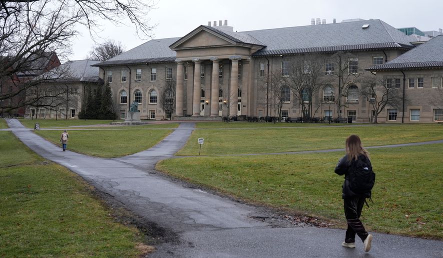 People walk on the campus of Cornell University in Ithaca, N.Y., on Friday, Feb. 2, 2024. (AP Photo/Seth Wenig) **FILE**