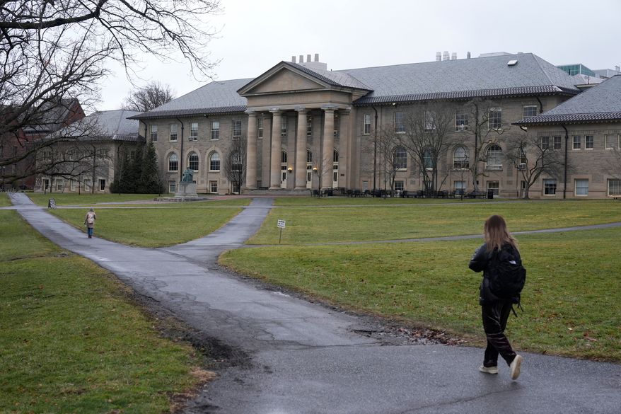 People walk on the campus of Cornell University in Ithaca, N.Y., on Friday, Feb. 2, 2024. (AP Photo/Seth Wenig) **FILE**