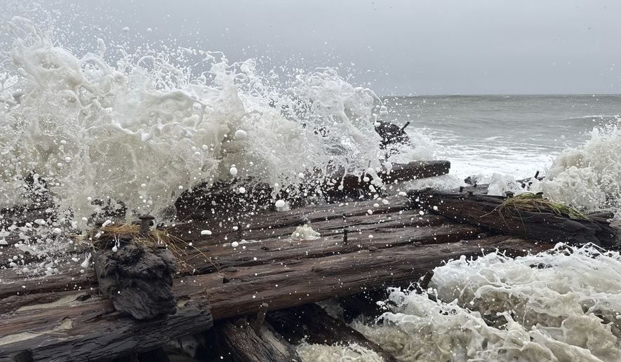 Shipwreck remains exposed by a powerful nor'easter are seen along the southern shore of Nantucket, Mass., Saturday, Sept. 26, 2026. Maritime experts were working to determine the identity of the vessel. (Jason Graziadei/Nantucket Current via AP)