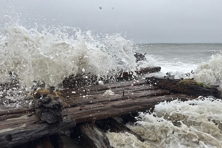 Shipwreck remains exposed by a powerful nor'easter are seen along the southern shore of Nantucket, Mass., Saturday, Sept. 26, 2026. Maritime experts were working to determine the identity of the vessel. (Jason Graziadei/Nantucket Current via AP)