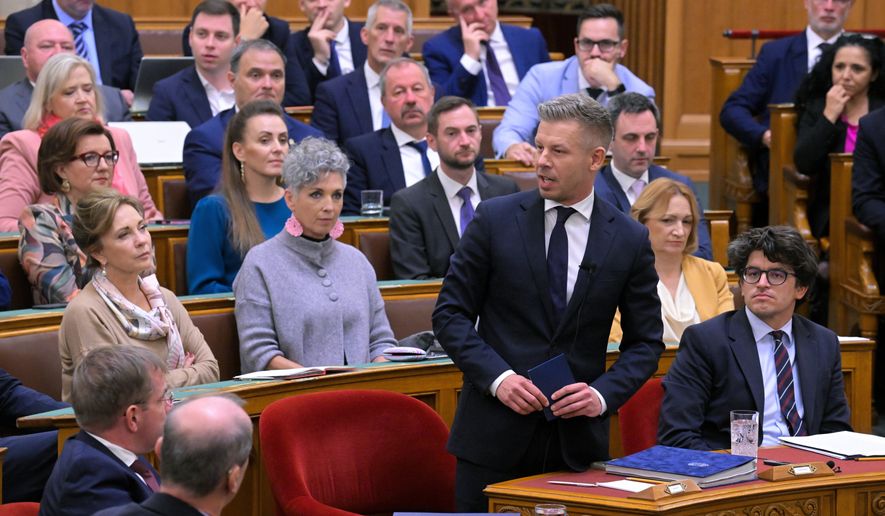 Hungarian Prime Minister Peter Magyar, center, attends an extraordinary session of the National Assembly, in Budapest, Hungary, Monday, Sept. 28, 2026. (Zsolt Szigetvary/MTI via AP)