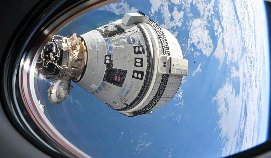 FILE - This photo provided by NASA shows Boeing's Starliner spacecraft docked to the International Space Station on July 3, 2024, seen from a window on the SpaceX Dragon Endeavour spacecraft docked to an adjacent port. (NASA via AP, File)