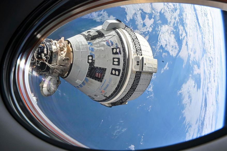 FILE - This photo provided by NASA shows Boeing's Starliner spacecraft docked to the International Space Station on July 3, 2024, seen from a window on the SpaceX Dragon Endeavour spacecraft docked to an adjacent port. (NASA via AP, File)