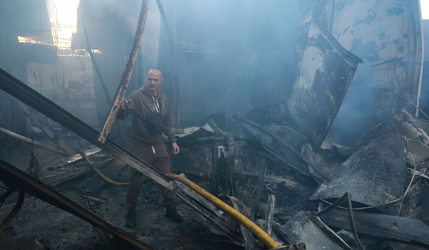 A man walks at the central market damaged in a Russian strike on Zaporizhzhia, Ukraine, on Saturday, Sept.26, 2026. (AP Photo/Kateryna Klochko)