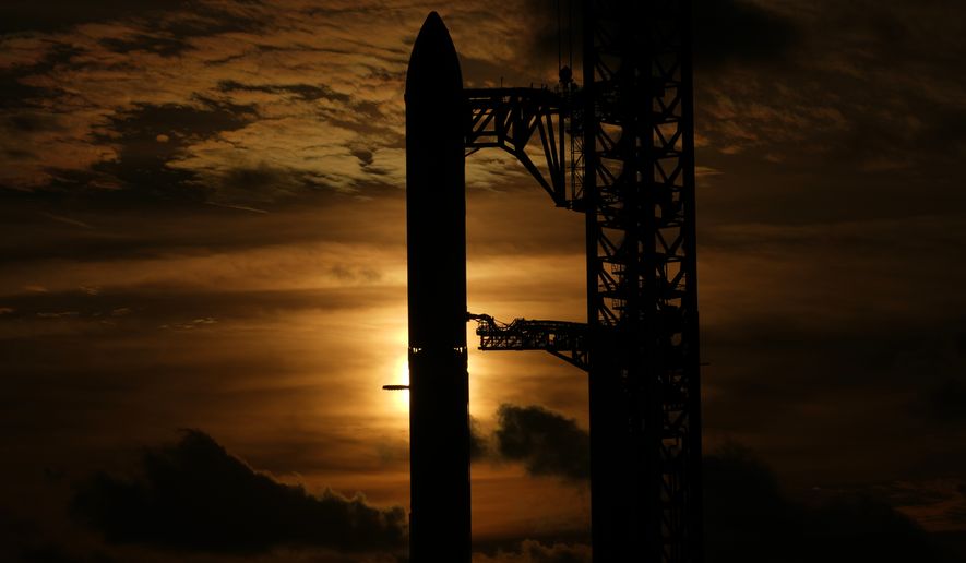 The sun set behind SpaceX's mega rocket Starship as it is prepared for a test flight from Starbase, Texas, Sunday, Sept. 27, 2026. (AP Photo/Eric Gay)