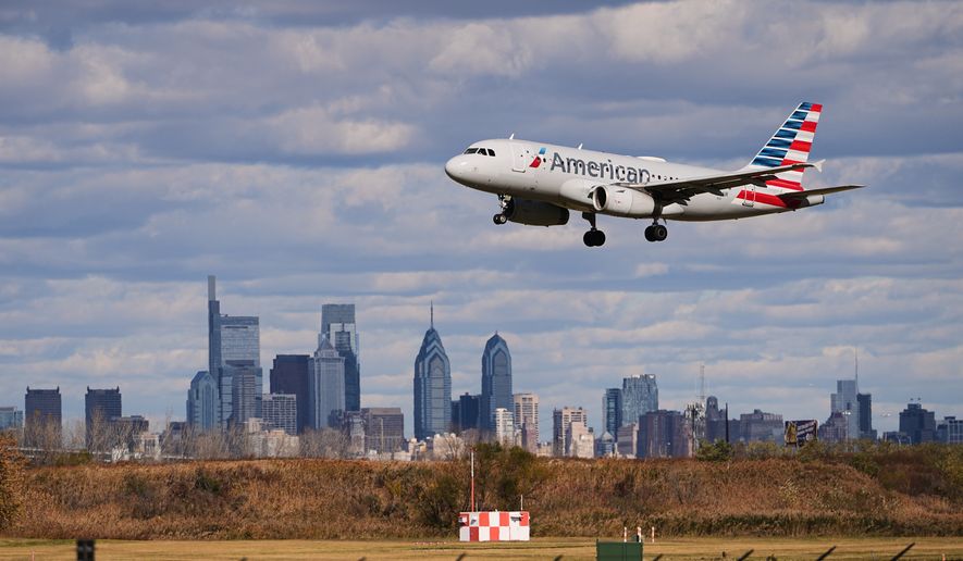 FILE - An aircraft lands at Philadelphia International Airport in Philadelphia, Nov. 6, 2025. (AP Photo/Matt Rourke, File)
