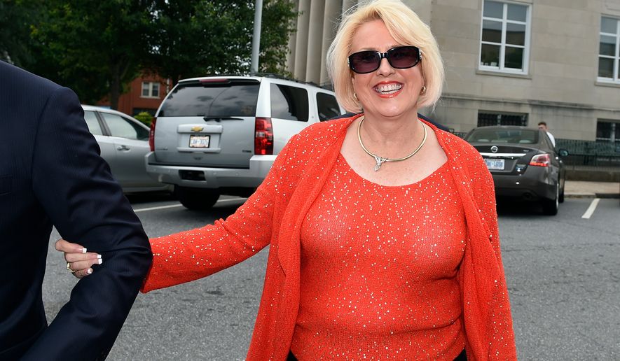 Brooke Covington, a member of the Word of Faith Fellowship church in Spindle, N.C., leaves a hearing at Rutherford County Courthouse in Rutherfordton, N.C., May 19, 2017. (AP Photo/Kathy Kmonicek, File)