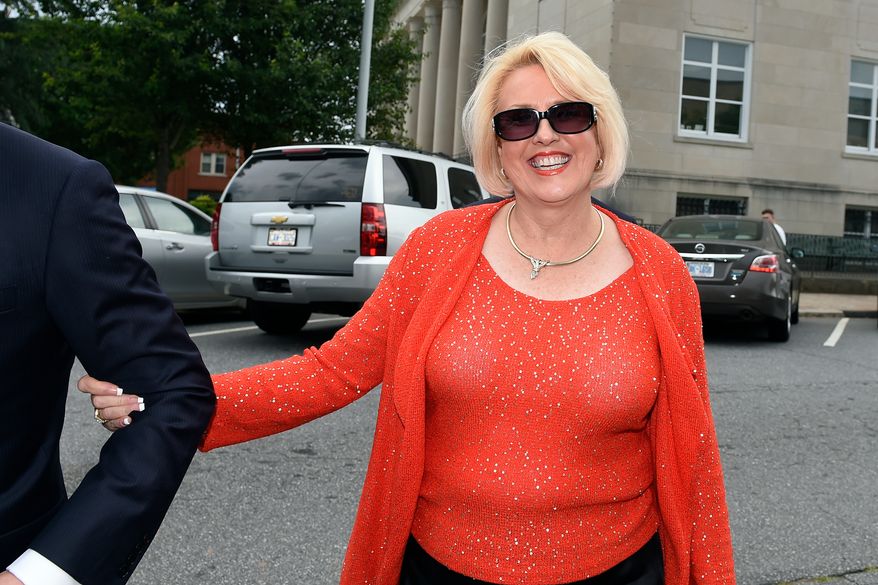 Brooke Covington, a member of the Word of Faith Fellowship church in Spindle, N.C., leaves a hearing at Rutherford County Courthouse in Rutherfordton, N.C., May 19, 2017. (AP Photo/Kathy Kmonicek, File)