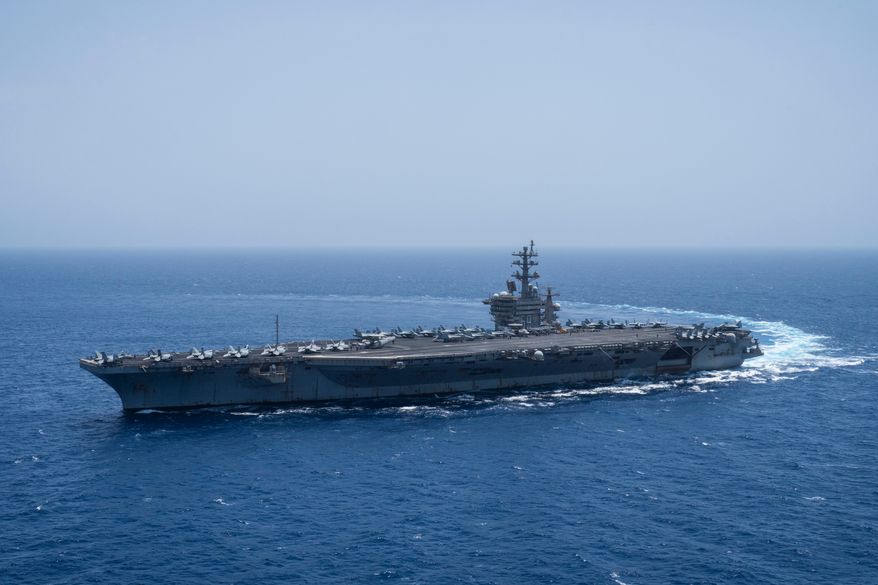 The USS aircraft carrier Dwight D. Eisenhower, also known as 'IKE', sails in the Red Sea, June 12, 2024. (AP Photo/Bernat Armangue, File)