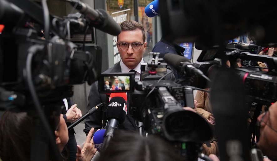 FILE - French far right National Rally party president Jordan Bardella answers reporters following a meeting, on Monday, Oct. 6, 2025 in Paris. (AP Photo/Christophe Ena, File)