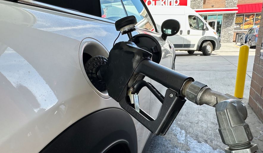 A motorist fills up the fuel tank of a vehicle at a QuikTrip gasoline stop Tuesday, Sept. 15, 2026, in Greenwood Village, Colo. (AP Photo/David Zalubowski)
