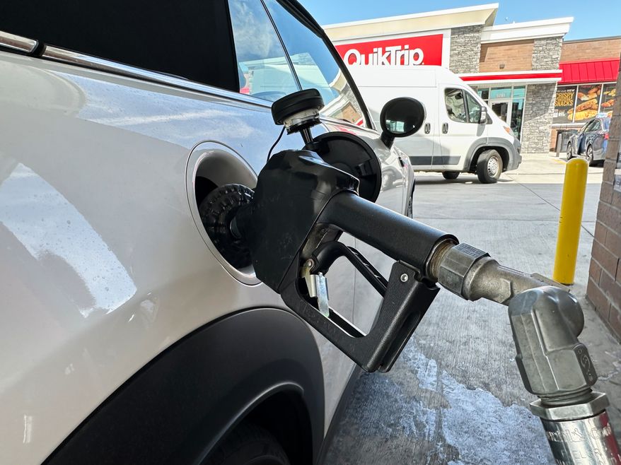 A motorist fills up the fuel tank of a vehicle at a QuikTrip gasoline stop Tuesday, Sept. 15, 2026, in Greenwood Village, Colo. (AP Photo/David Zalubowski)