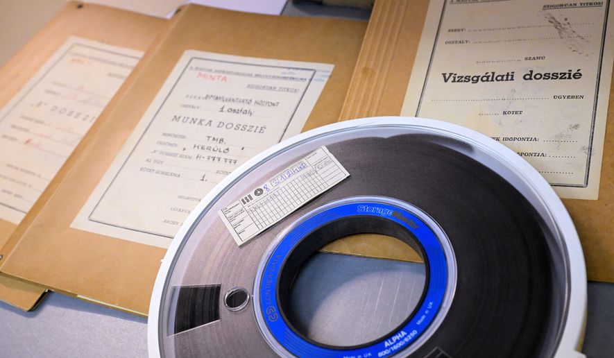 A magnetic tape for data storage and dossiers iare pictured in the Historical Archives of the Hungarian State Security Services (ABTL) in Budapest, Hungary, Tuesday, Sept. 29, 2026. (Zsolt Szigetvary /MTI via AP)