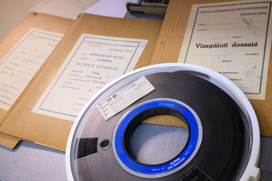A magnetic tape for data storage and dossiers iare pictured in the Historical Archives of the Hungarian State Security Services (ABTL) in Budapest, Hungary, Tuesday, Sept. 29, 2026. (Zsolt Szigetvary /MTI via AP)