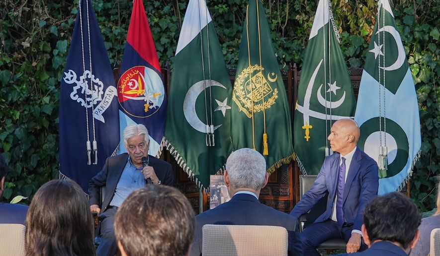 Pakistan's Defense Minister Khawaja Mohammad Asif, left, speaks with media at the Pakistani Embassy in Rome, Italy, Tuesday, Sept. 29, 2026. At right Pakistan's Ambassador to Italy Ali Javed looks on. (AP Photo/Andrea Rosa)