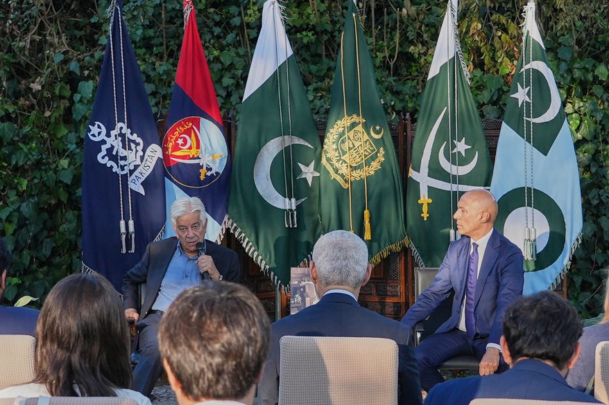 Pakistan's Defense Minister Khawaja Mohammad Asif, left, speaks with media at the Pakistani Embassy in Rome, Italy, Tuesday, Sept. 29, 2026. At right Pakistan's Ambassador to Italy Ali Javed looks on. (AP Photo/Andrea Rosa)