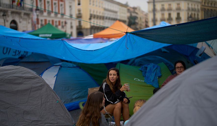 Demonstrators camp during a protest at Sol Square following the eviction last Wednesday of 87-year-old Maricarmen as they demand stronger laws to protect renters in Madrid, Spain, Monday, Sept. 28, 2026. (AP Photo/Manu Fernandez)