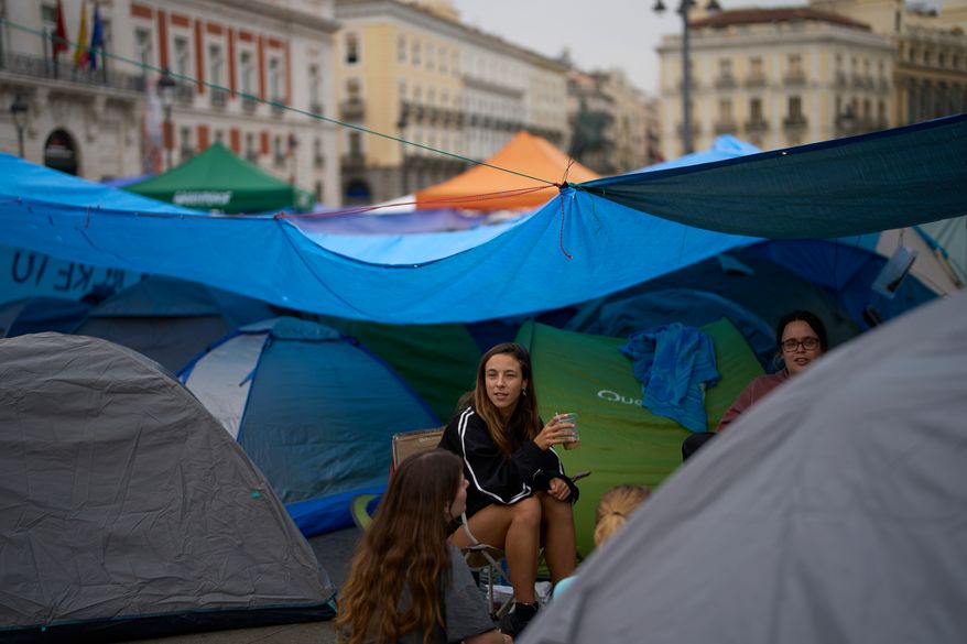 Demonstrators camp during a protest at Sol Square following the eviction last Wednesday of 87-year-old Maricarmen as they demand stronger laws to protect renters in Madrid, Spain, Monday, Sept. 28, 2026. (AP Photo/Manu Fernandez)