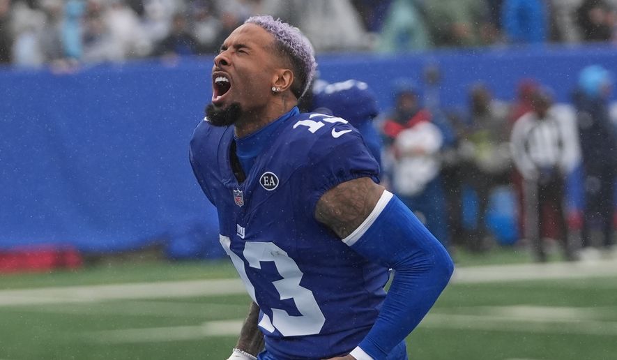 New York Giants wide receiver Odell Beckham Jr. (13) screams as he runs onto the field before an NFL football game against the Tennessee Titans in East Rutherford, N.J., Sunday, Sept. 27, 2026. (AP Photo/Frank Franklin II)