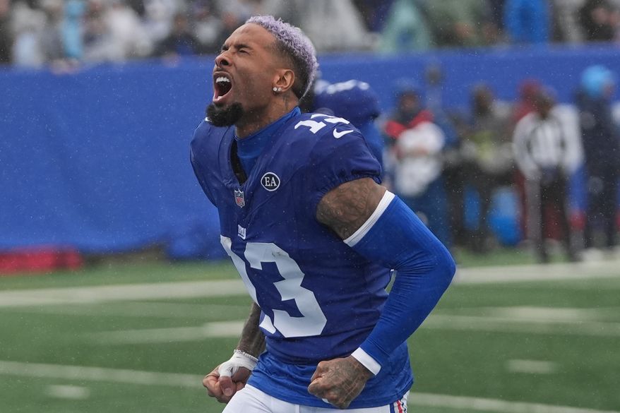 New York Giants wide receiver Odell Beckham Jr. (13) screams as he runs onto the field before an NFL football game against the Tennessee Titans in East Rutherford, N.J., Sunday, Sept. 27, 2026. (AP Photo/Frank Franklin II)