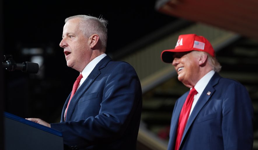 President Donald Trump listens as North Carolina Republican U.S. Senate candidate Michael Whatley speaks during a rally at Gastonia Municipal Airport, Wednesday, Sept. 16, 2026, in Gastonia, N.C. (AP Photo/Alex Brandon)