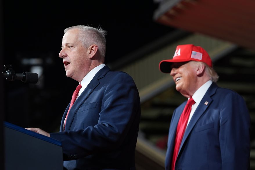 President Donald Trump listens as North Carolina Republican U.S. Senate candidate Michael Whatley speaks during a rally at Gastonia Municipal Airport, Wednesday, Sept. 16, 2026, in Gastonia, N.C. (AP Photo/Alex Brandon)